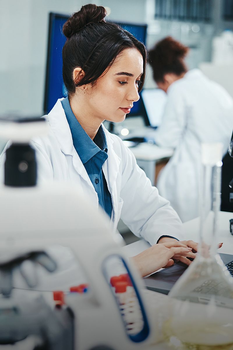 Scientist working in a laboratory setting.